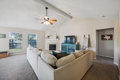 Carpeted living room featuring vaulted ceiling wit