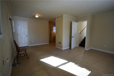 Living room and breakfast area adjacent to kitchen