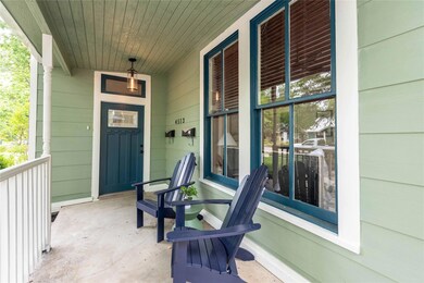 Entrance to property featuring covered porch