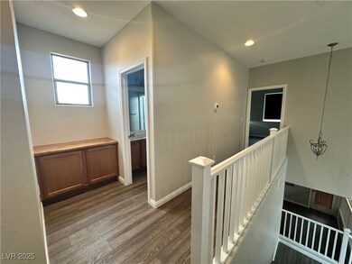 Corridor featuring an upstairs landing, dark wood