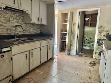 Kitchen featuring light tile patterned floors, whi