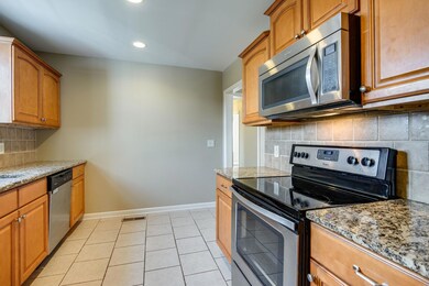 The full, matching kitchen suite has a over-the-range microwave. Beautiful cabinets were added during renovation and will easily organize and house all of your kitchen essentials.