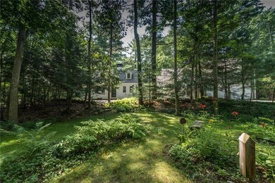 House sits back on private lot,...