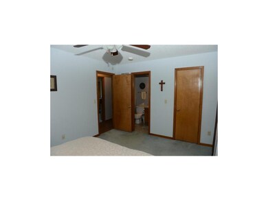 Master bedroom with closet and private bathroom.
