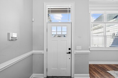 Foyer entrance featuring dark hardwood / wood-styl