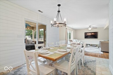 The dining area connects the kitchen and family room. Updated lighting throughout.