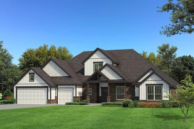 View of front of house with a garage and a front y