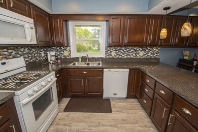 Kitchen has updates: countertops, tile backsplash,