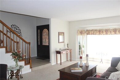 The formal living room looking back at the front d