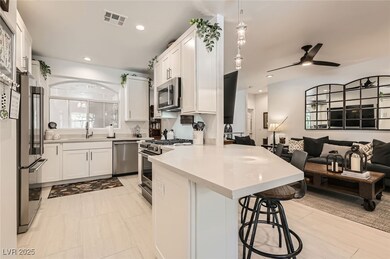 Kitchen with a peninsula, open floor plan, stainle