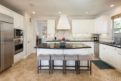 Entertainer's kitchen with built-in refrigerator, 