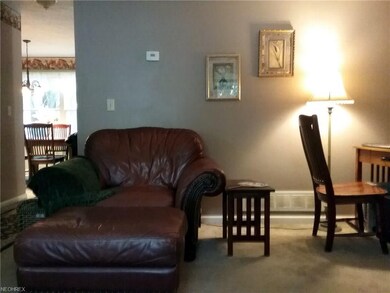 Living room connects to the dining room and kitche