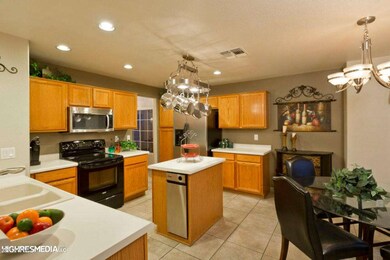 Kitchen full shot w peek of eat in
