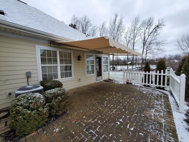 Electric Awning over Brick Paver Patio