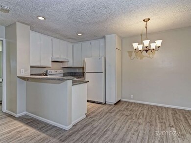Kitchen with granite counter tops.