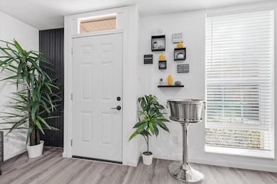 Entryway featuring light wood finished floors and baseboards