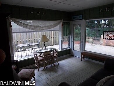 Bright and cheery room overlooks a fenced-in back yard and patio area
