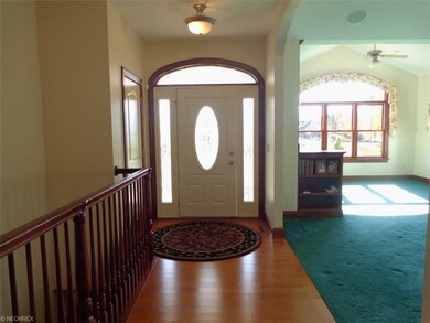 Coming into the front door, the stairs to the fini