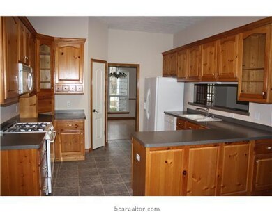 Kitchen. kitchen with appliance garage and built in cutting board.
