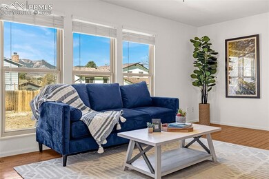 Living room featuring wood finished floors and bas