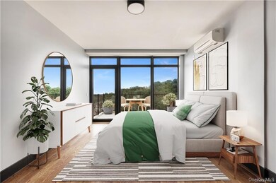 Bedroom featuring light wood-style flooring, a wall unit AC, baseboards, and a wall of windows
