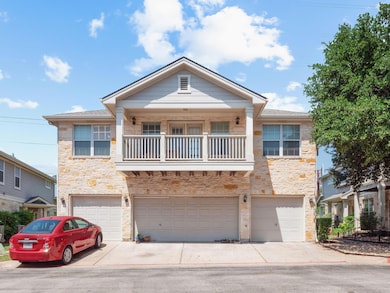 View of front of house with stone siding, an atta