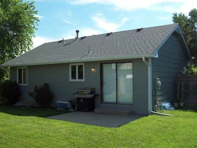 BEAUTIFUL BACKYARD WITH LARGE PATIO AND WOOD FENCI