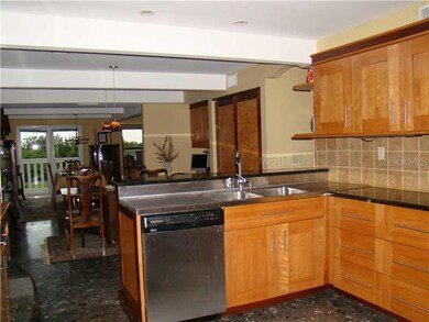Kitchen - Custom designed and built  Kitchen made with  rare pink birch. Top of the line Kitchen Aid Stainless steel appliances