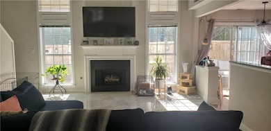 Living room featuring a fireplace and baseboards