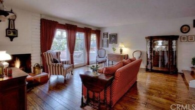 LIVING ROOM WITH VIEW OF PATIO ON THE GREENBELT