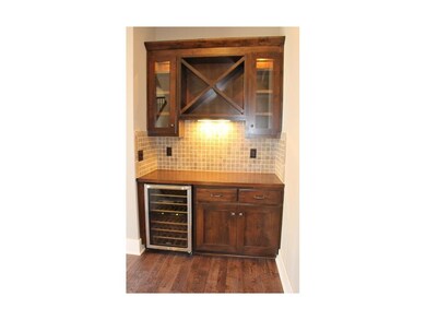 Butler's pantry has wine cooler