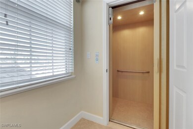 Bathroom featuring tile patterned floors, baseboar