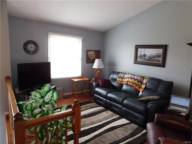 Large, open living room with vaulted ceiling and n