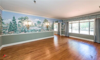Huge dining room has crown molding, chair railing,