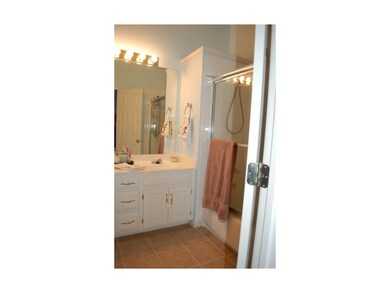 Master Bath has tile floors and double vanities.