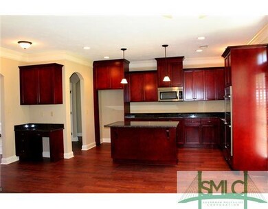 Kitchen. Gorgeous cabinetry with crown molding, gr