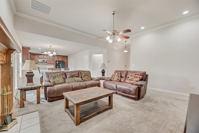 Open living, dining and kitchen space.