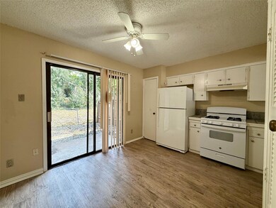 Kitchen with white appliances, under cabinet rang
