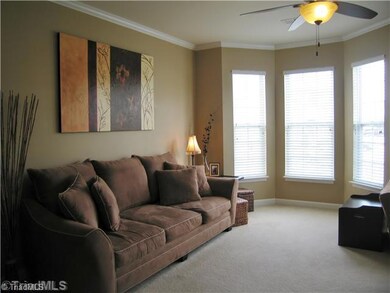 Living Room. From the natural light of the bay window, to the trim work and neutral paint colors, this is sure to be a favorite spot to relax!
