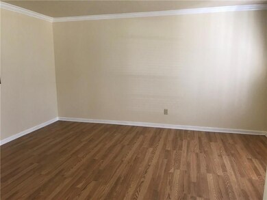 Large Living Room, located off Foyer. New Laminate