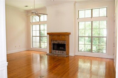 Formal Living Room. Wood-burning fireplace with ga