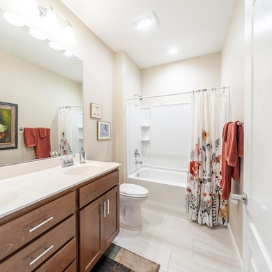 Plenty of lighting offers a nice bright guest bathroom