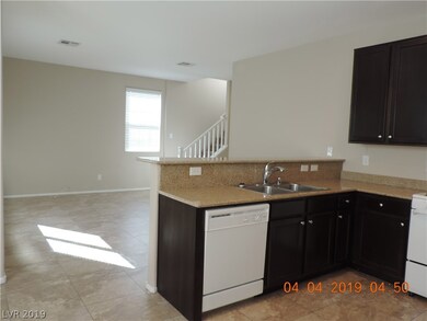 Living room (background)  with breakfast bar and k