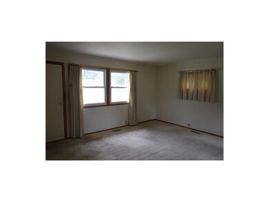 Livingroom- Per the seller, there is hardwood floo