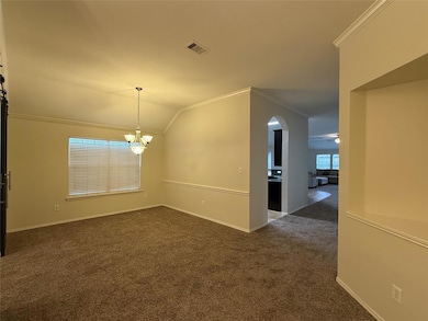 Carpeted spare room with ceiling fan with notable 