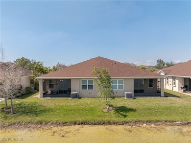 Back of house with central AC unit, stucco siding,