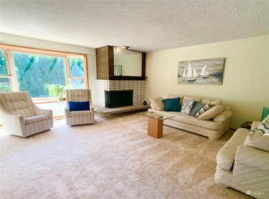 Peaceful living room with Bay window looks out to private back yard
