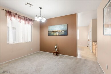 Empty room with light carpet, a healthy amount of