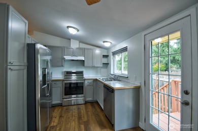 Updated kitchen with stainless steel appliances.