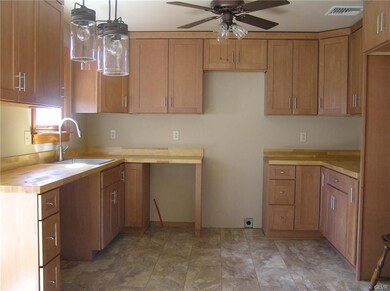 New maple kitchen cabinetry & plank flooring.  App